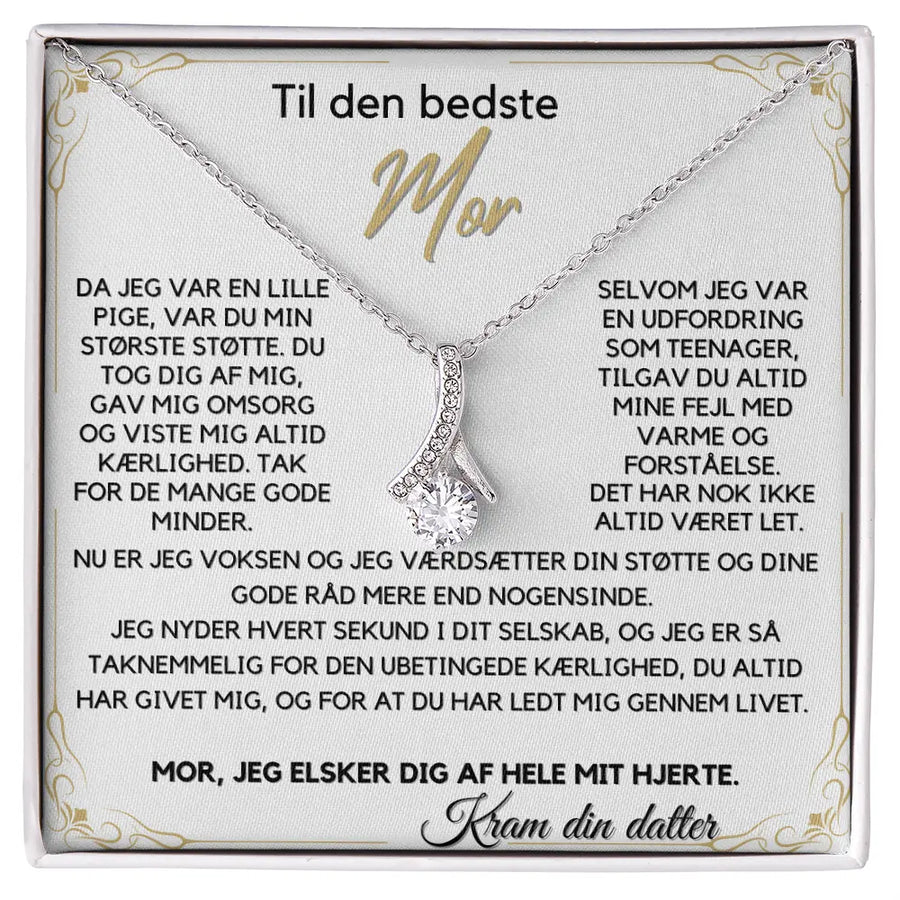 Alluring Beauty halskæde i rustfrit stål belagt med 14 karat hvidguld, med sløjfeformet vedhæng og 7 mm Cubic