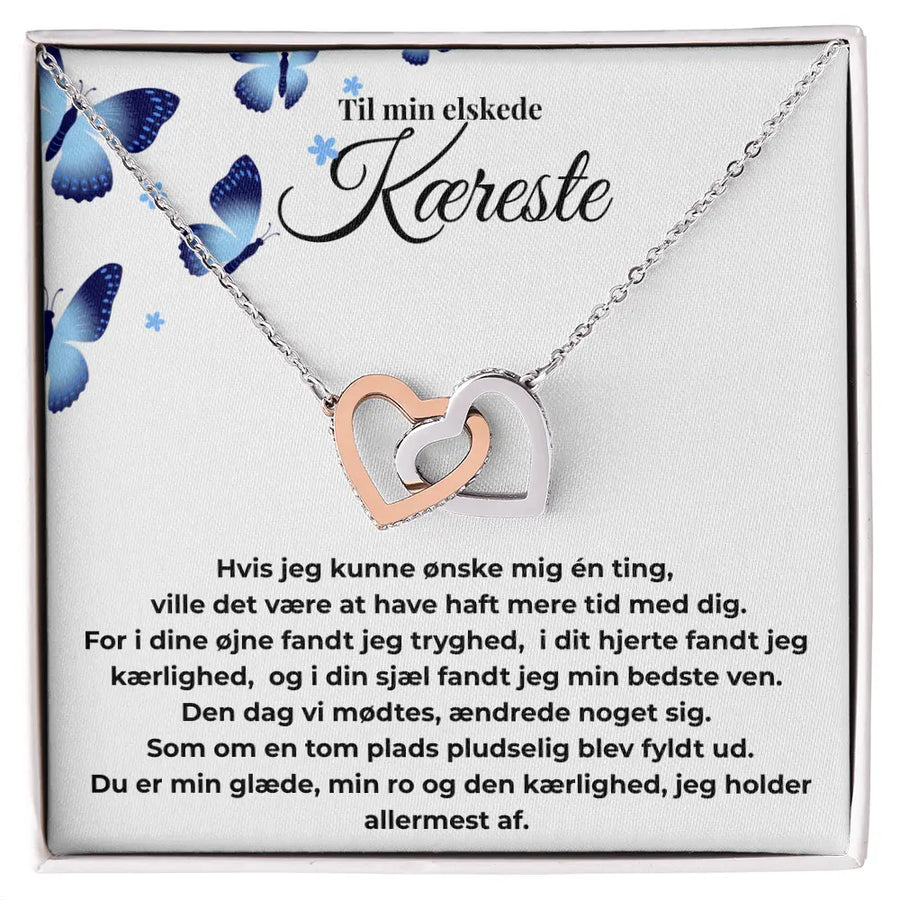 Interlocking Hearts halskæde i rosaguld og stål  til hende – et symbol på kærlighed og nærhed