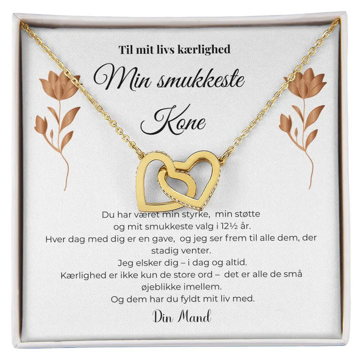 Halskæde med to sammenflettede hjerter i guldbelagt finish, symbol på kærlighed og fælles liv, gave til kone på kobberbryllup